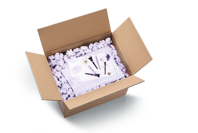 
			Open cardboard box filled with Custom Shape Loose Fill
